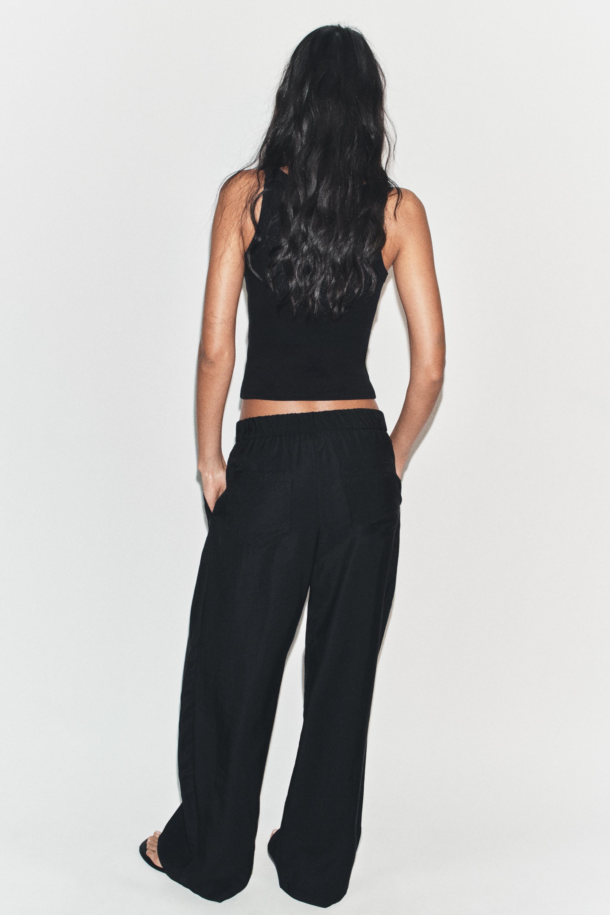 FLOWY PLEATED PANTS